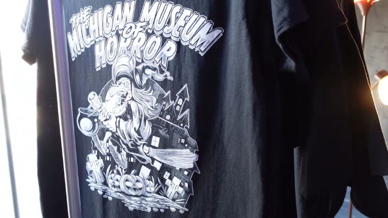 A T-Shirt Featuring the Michigan Museum of Horror Logo Displayed Inside the Museum