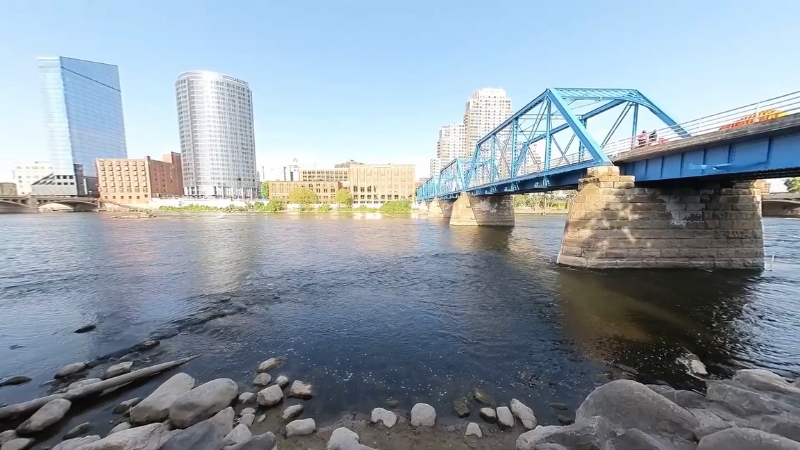 A View of The Blue Bridge Crossing the Grand River with Downtown Grand Rapids' Skyline in The Background